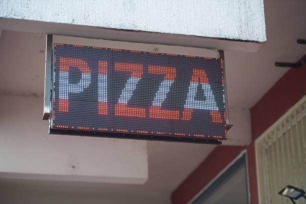 istock Pizza LED sign on the street for advertising 1397200426