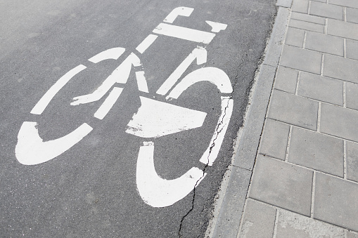 Bicycle symbol on a bike lane with directional arrow