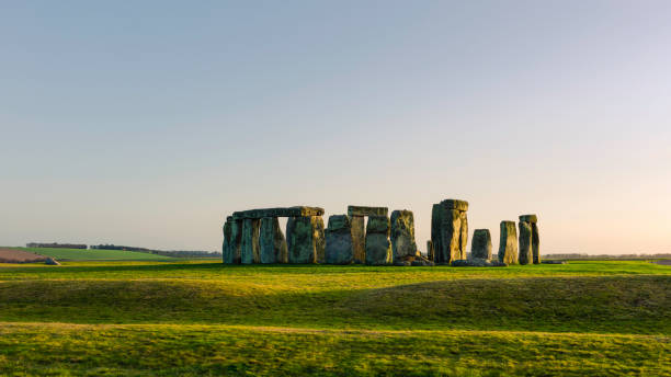 istock Stonehenge, prehistoric standing stones under blue sky in spring. Amesbury, UK. 1397201663