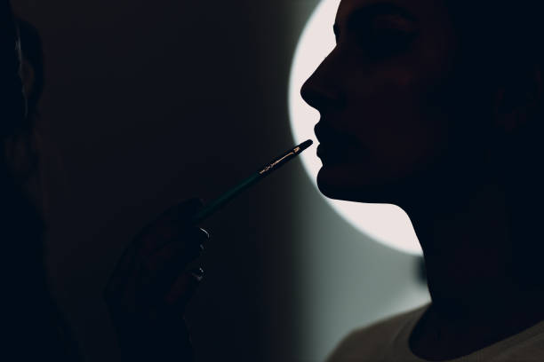 istock Beautiful young woman applying makeup beauty visage brush 1397201735