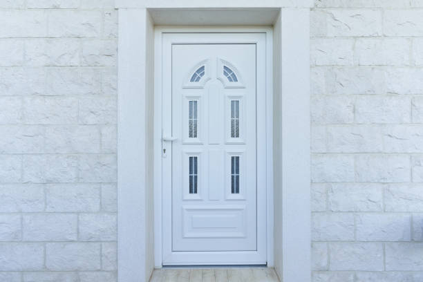istock White front door and stone wall in a residential building 1397201853