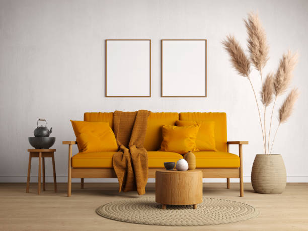 Living room interior.Wooden sofa with yellow cushion on white wall background and blank picture frame.3d rendering stock photo