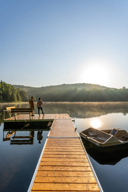 istock Couple on vacation by a lake. 1397202585