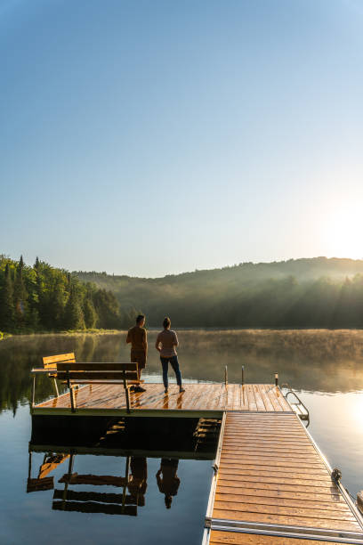istock Couple on vacation by a lake. 1397202672