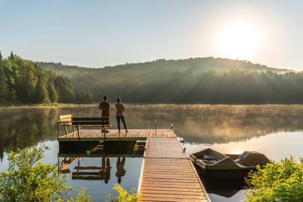 istock Couple on vacation by a lake. 1397202723