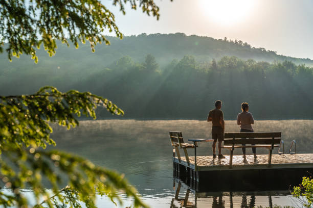istock Couple on vacation by a lake. 1397202737