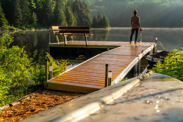 istock A woman on vacation by a lake. 1397202878