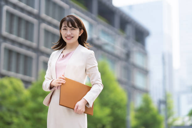 istock Business woman standing in the office district 1397203829