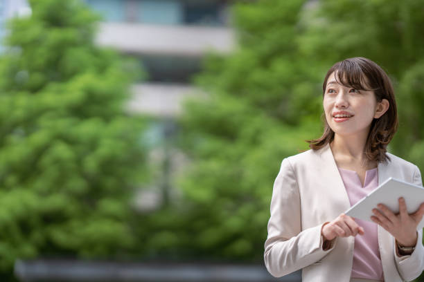 istock Business woman standing in the office district 1397204033
