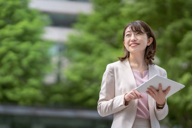 istock Business woman standing in the office district 1397204036