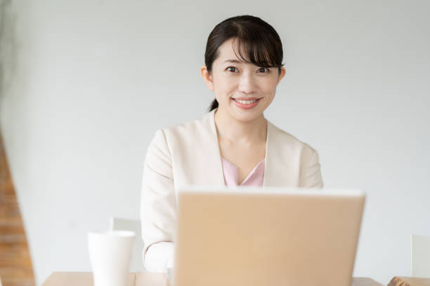 istock Business woman operating a personal computer 1397204463