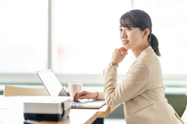 istock Business woman operating a personal computer 1397204553