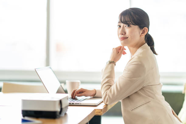 istock Business woman operating a personal computer 1397204558
