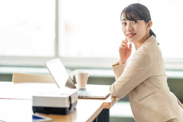 istock Business woman operating a personal computer 1397204572