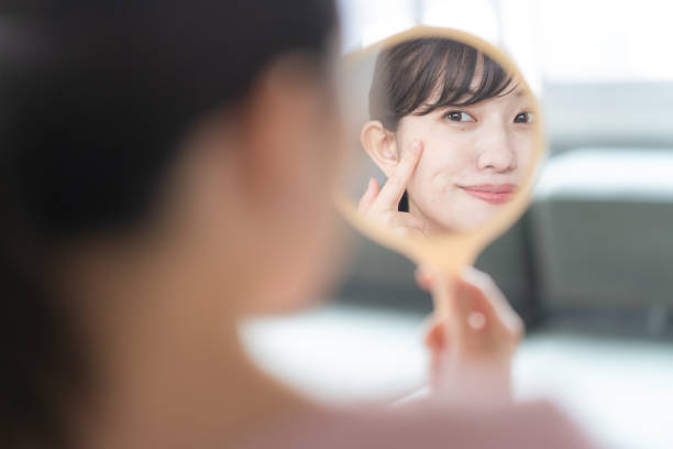 istock Woman looking in the mirror 1397205547