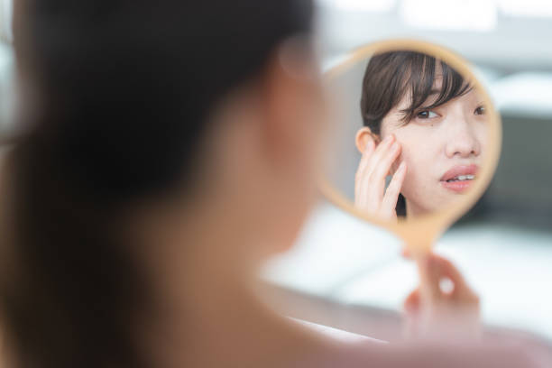 istock Woman looking in the mirror 1397205577
