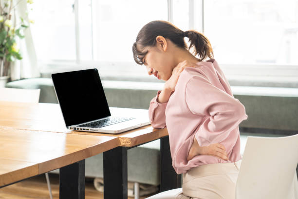 istock Business woman suffering from stiff shoulders 1397205810