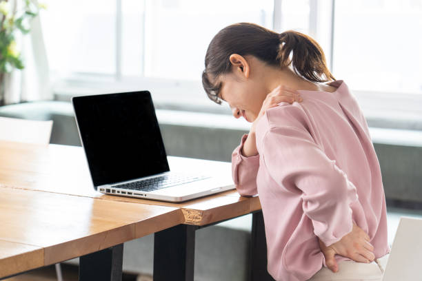 istock Business woman suffering from stiff shoulders 1397205814