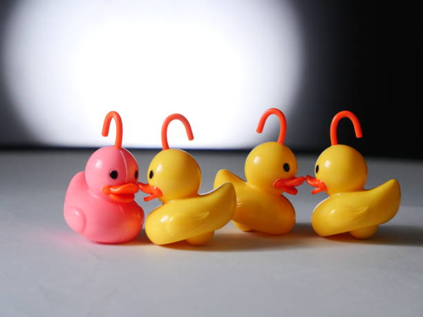 istock plastic ducks on white - Background Individuality Ideas stock photo 1397205826