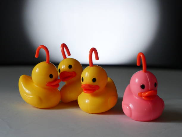 istock plastic ducks on white - Background Individuality Ideas stock photo 1397206501