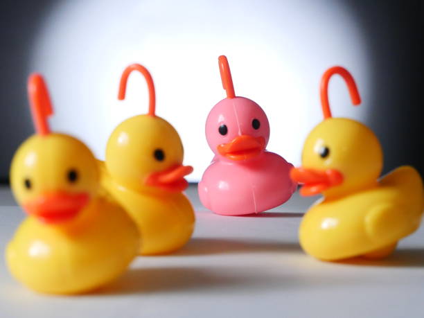 istock plastic ducks on white - Background Individuality Ideas stock photo 1397206547
