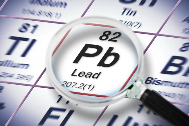 istock Lead chemical element with the Mendeleev periodic table - Concept image seen through a magnifying glass 1397206849