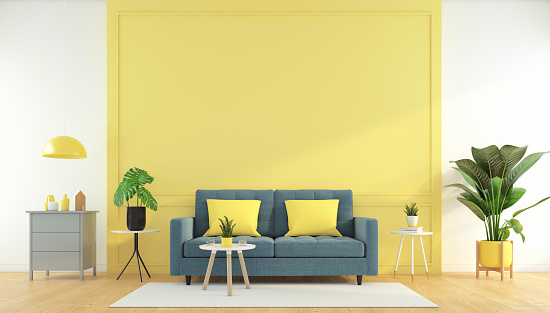 Yellow living room with sofa and side table, wood floor, green plants. 3d rendering