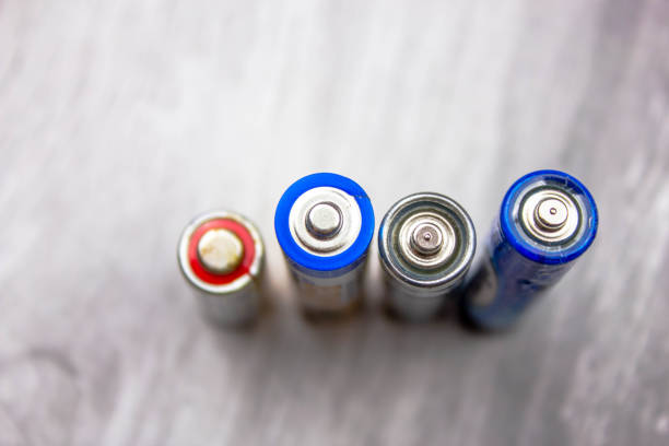 The AA batteries close-up. Recycling and disposal of used batteries.