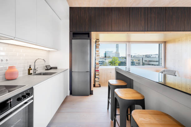 istock Modern Kitchen in a Penthouse Loft Apartment with City View 1397209265