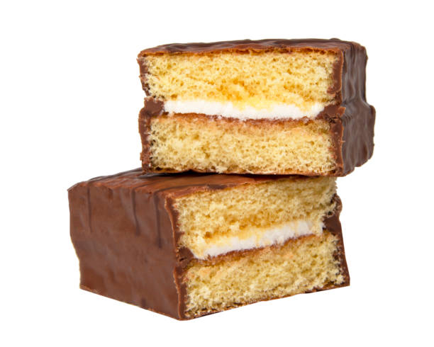 istock Biscuit cake with cream filling glazed chocolate isolated on the white 1397209309
