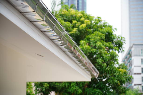 Metal rain gutter metal tile roof and rain gutter at winter steel gutters stock pictures, royalty-free photos & images