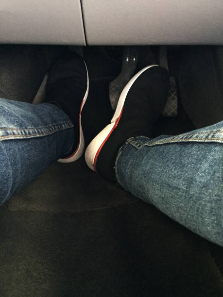 Driver foot on the car pedals