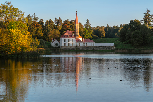 Priory Palace on the shore of the Black Lake on an autumn sunny day, Gatchina, St. Petersburg, Russia
