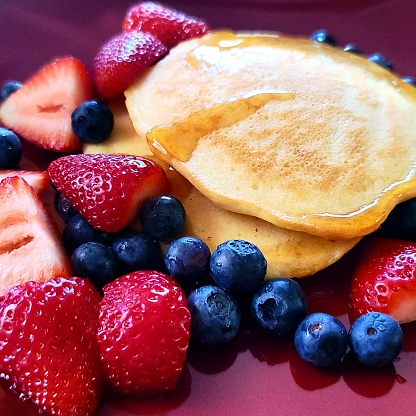 Paleo Gluten Free pancakes with Strawbereies and Blueberries