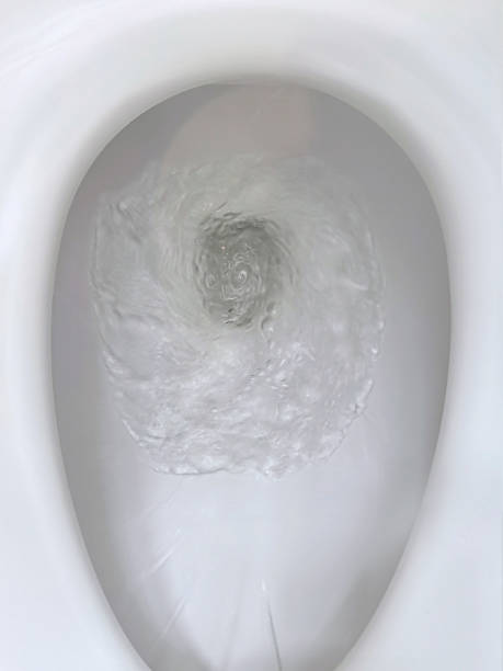 istock Toilet, Flushing Water, close up 1397220539