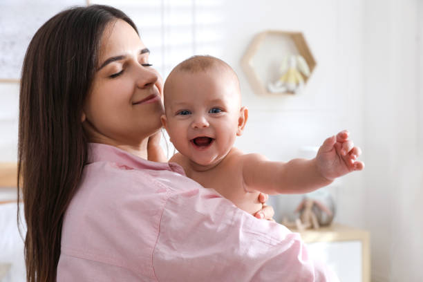 istock Mother with her cute baby at home 1397221811