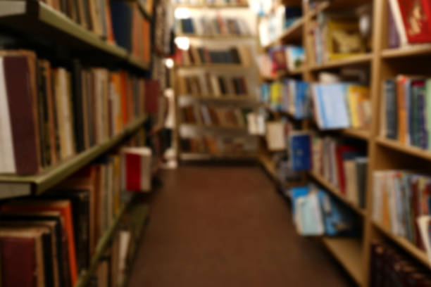istock Blurred view of books on shelves in library 1397221823