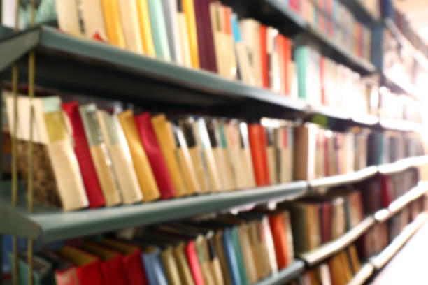 istock Blurred view of books on shelves in library 1397221839