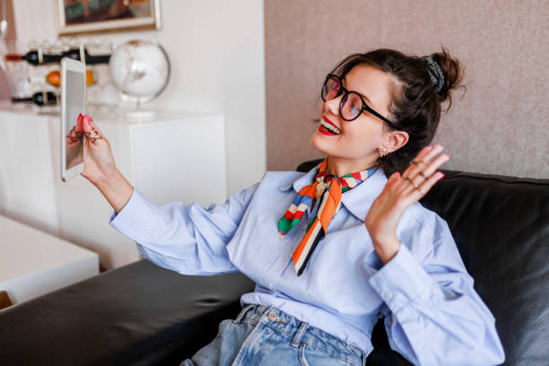 istock Young  hipster woman having video call on digital tablet 1397221963