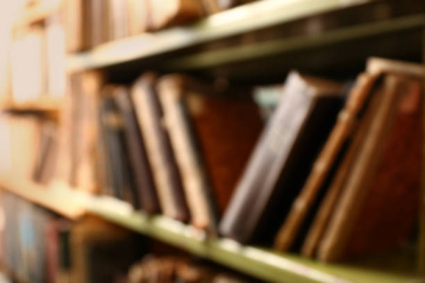 istock Blurred view of books on shelves in library 1397221967