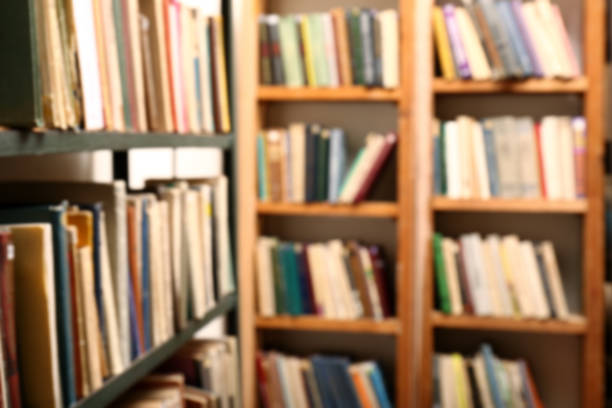 istock Blurred view of books on shelves in library 1397221991