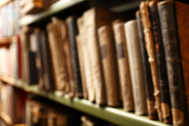 istock Blurred view of old books on shelf in library 1397222031