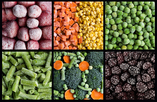 Collage of frozen berry and vegetable on the black background. Close-up.