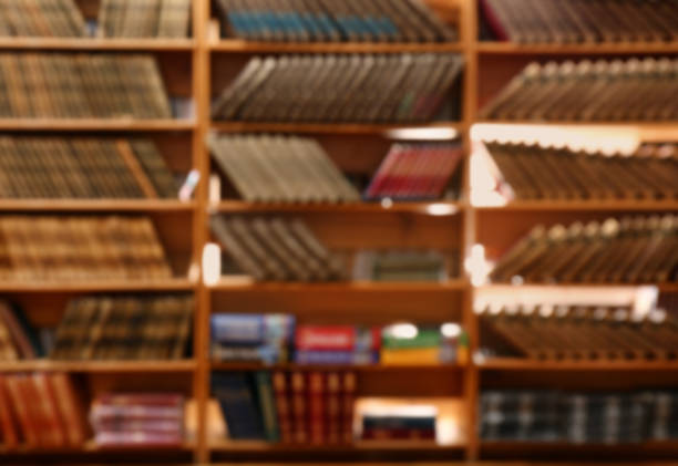 istock Blurred view of books on shelves in library 1397222049