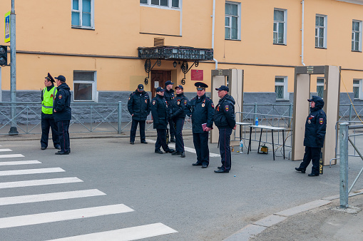 Petrozavodsk, Russia - 9 May 2022. police officers and metal detector frames on the street