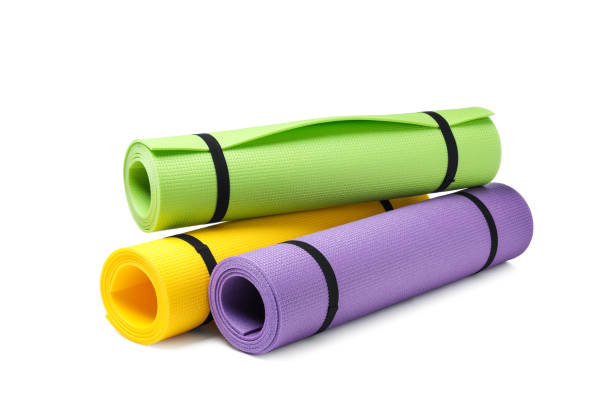 istock Colorful rolled camping or exercise mats on white background 1397223163
