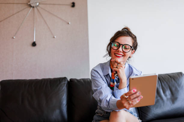 istock Young  hipster woman having video call on digital tablet 1397223330
