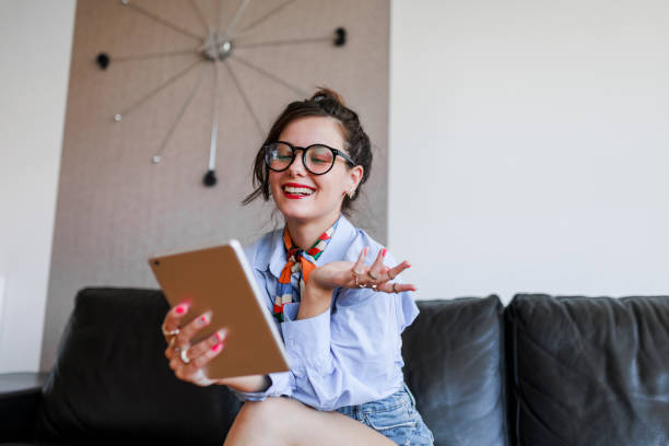 istock Young  hipster woman having video call on digital tablet 1397223344