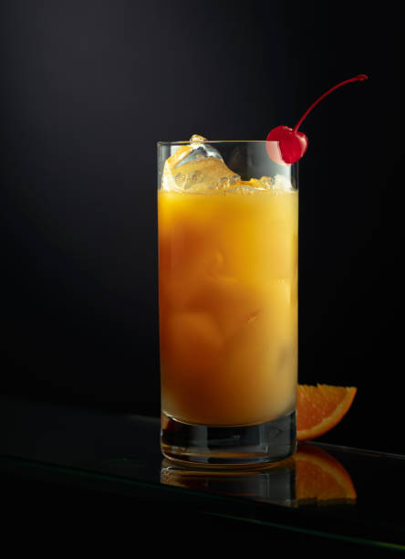 istock Orange juice in a tall glass with ice. 1397224072