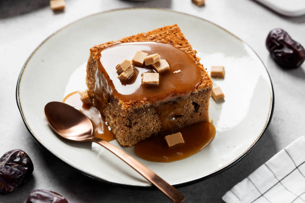 Sticky Toffee Pudding Easy Sticky Toffee Pudding is a deliciously gooey sponge cake drenched in warm toffee sauce that��’s a favorite among the English. mousse dessert stock pictures, royalty-free photos & images